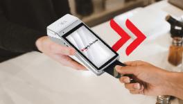 Hand with a card and POS